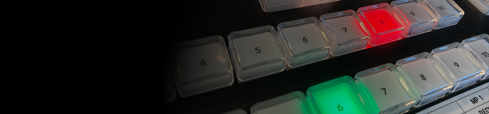 Production console controls lit during a live show