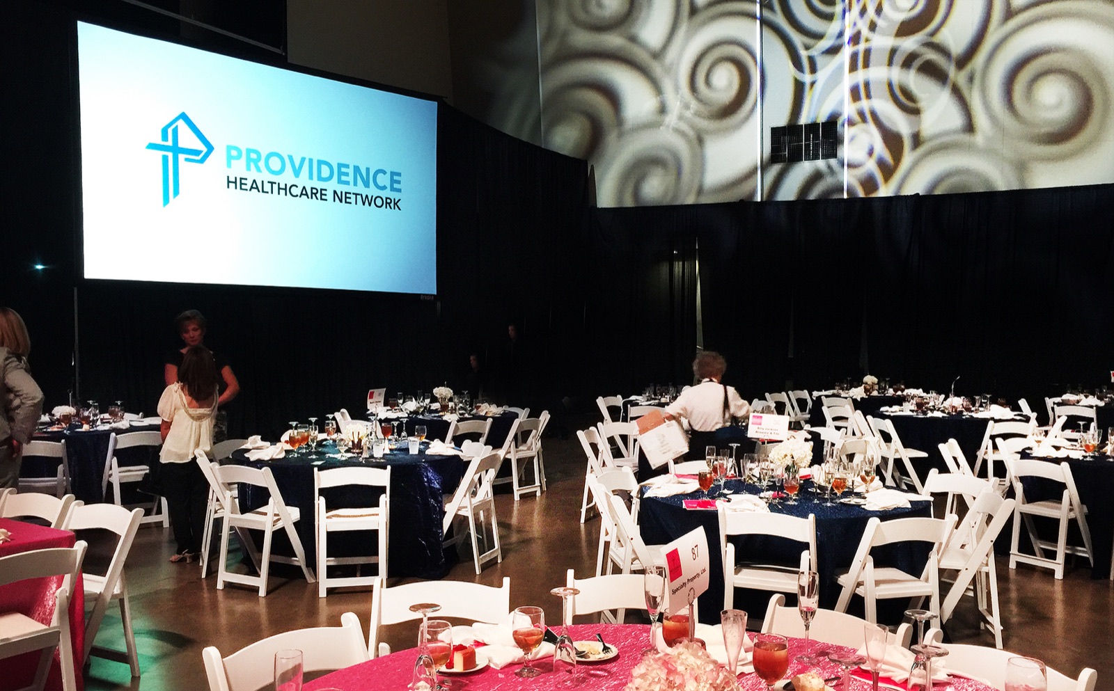 Banquet room with projection screen and event seating