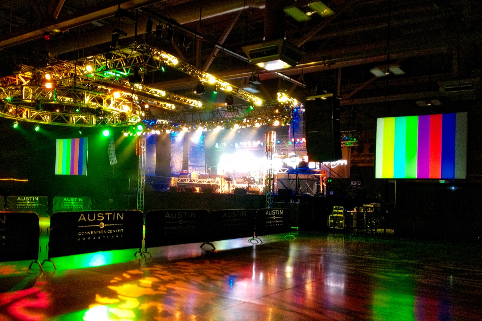 Stage with color lighting and truss rigging in an event venue